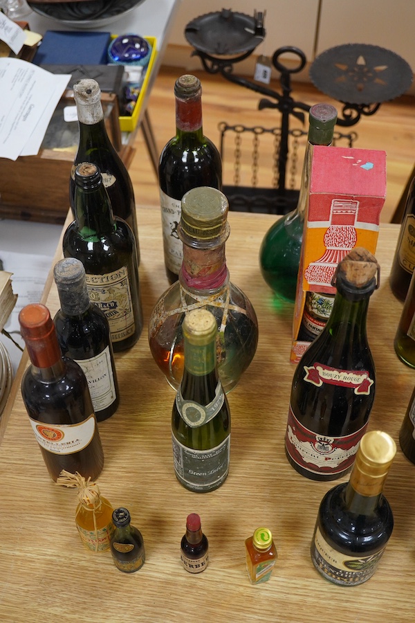 Twenty bottles of spirits, liqueurs and wine, together with some half bottles and miniatures, including; a 1947 Heidsieck & Co. Dry Monopole champagne, a 1983 Chateau Ferrande Bordeaux, two bottles of Herbes Mesclades, a